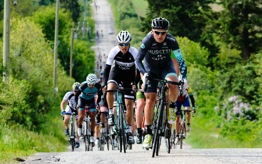Photo of cyclists racing up a hill